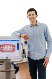 Dr. Zach Frazier, orthodontist in Downers Grove, with a 3D tooth scanner used for braces and Invisalign treatment.
