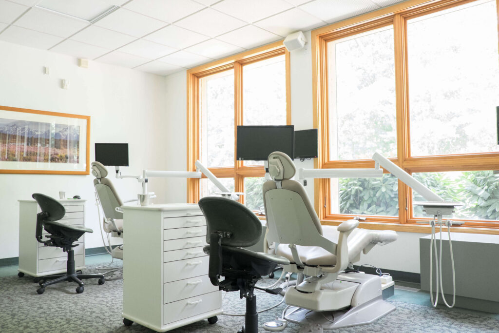 A view of the clinic at Friedman Aronson Orthodontics with patient chairs and big windows with natural light