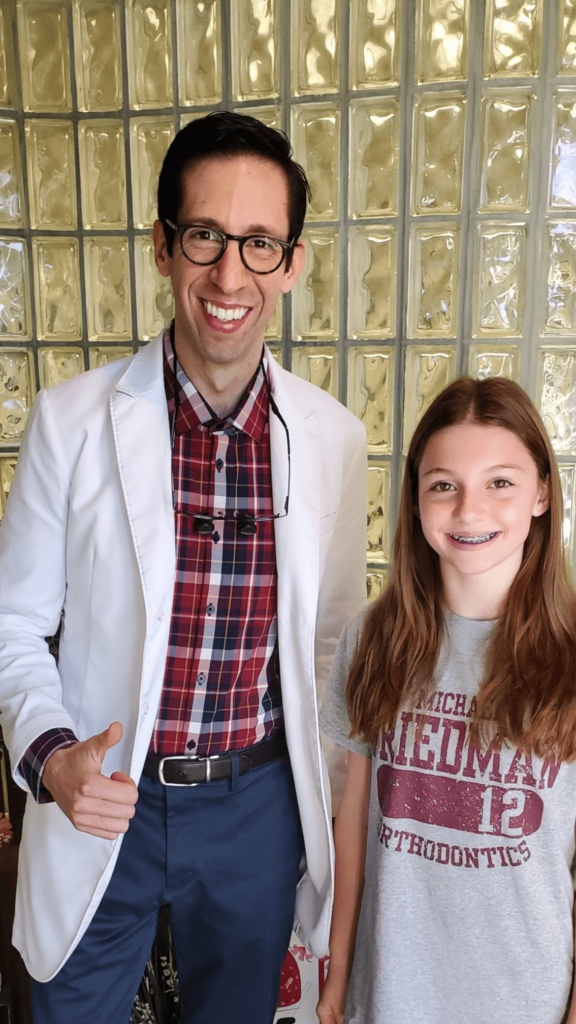 New braces patient and Dr. Aronson at Friedman Aronson Orthodontics near Middlebury, CT