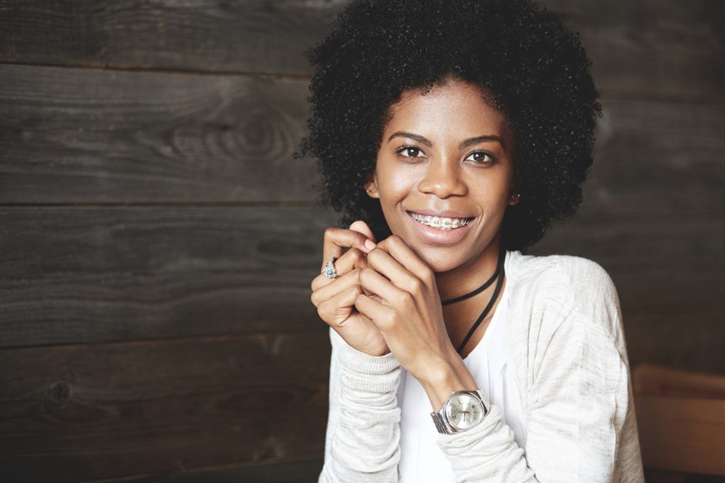 Young woman with clear braces