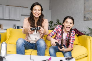 Mother playing video games with daughter