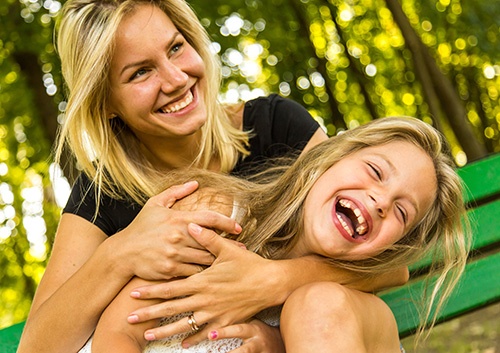 woman and girl laughing