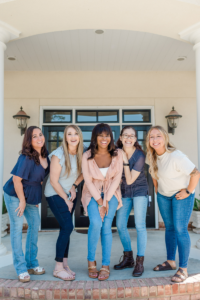 orthodontic team smiles for the camera