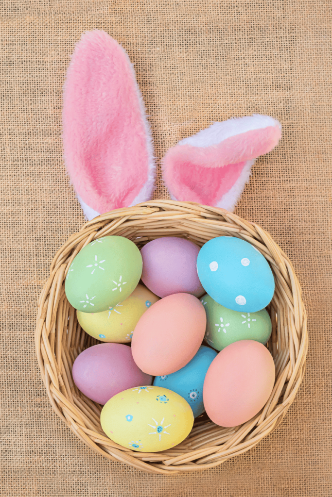 An Easter basket decorated with colorful hard boiled eggs.